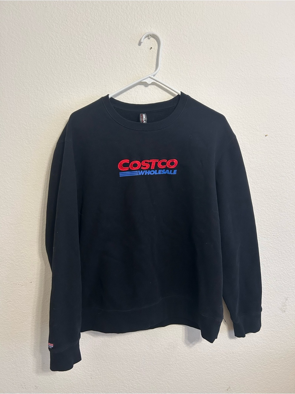 Kirkland Signature Black Crewneck Sweatshirt with Red & Blue Logo